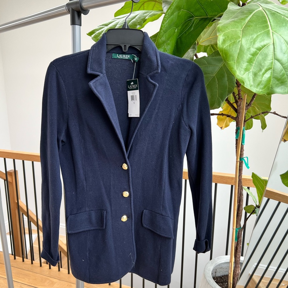 Navy blue blazer with gold buttons and tags